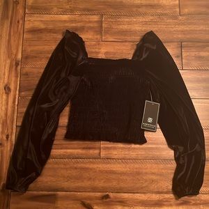 Small Black Long Sleeve Top. Velvet like material. Brand: Bagatelle